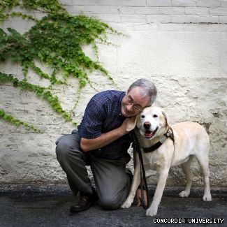 Bissonnette, who’s legally blind, kneels with his guide dog Nugget, pictured here in 2008. Since Nugget retired in October, he’s welcomed his new guide dog, Vesper, who turned two on April 26. “The new one, he’s full of pep,” he says. 